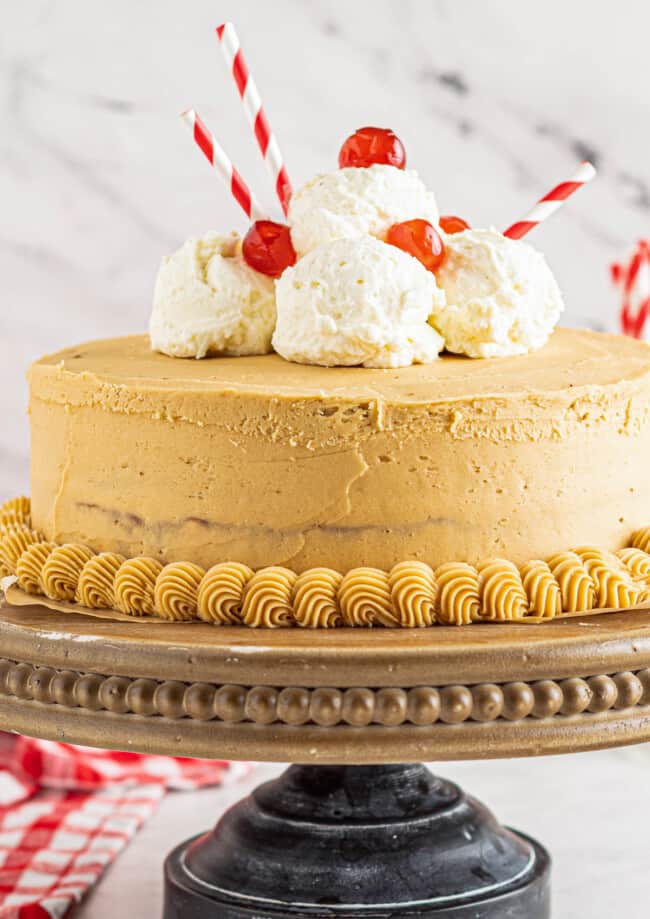 up close root beer float layer cake on cake stand