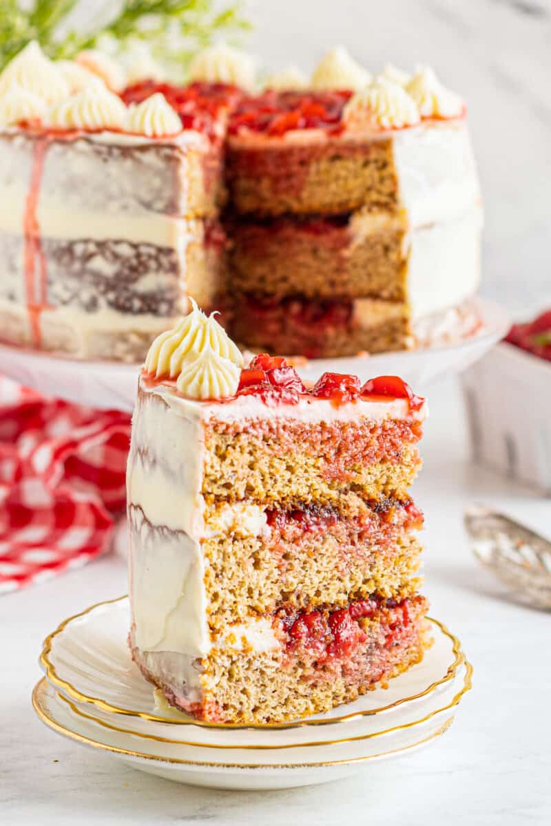 slice of strawberry layer cake on white plate