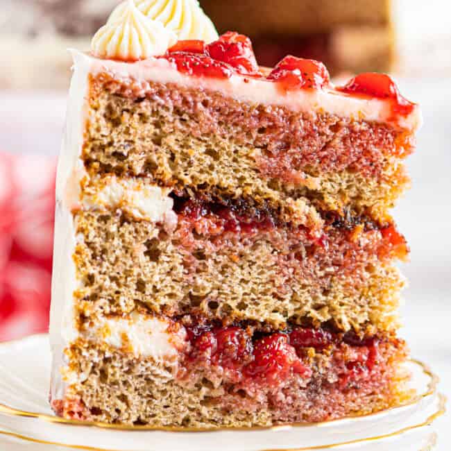 up close slice of strawberry layer cake