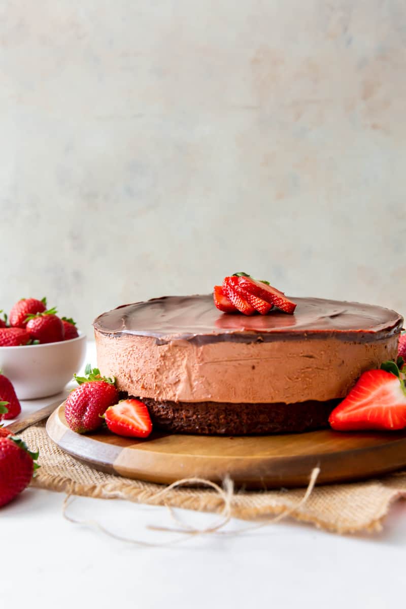 chocolate mousse cake on a wood serving board