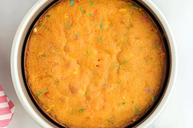 baked funfetti cake in a cake pan.