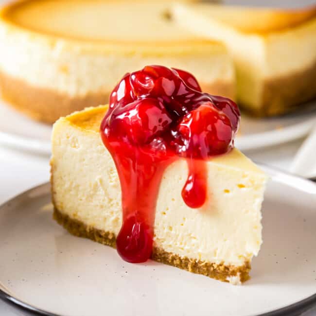 new york cheesecake topped with cherries