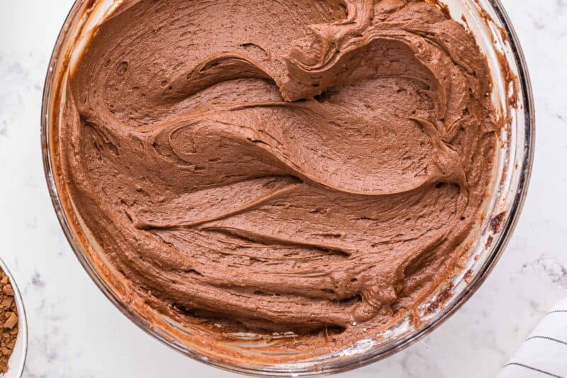 fluffy chocolate buttercream in a glass bowl.