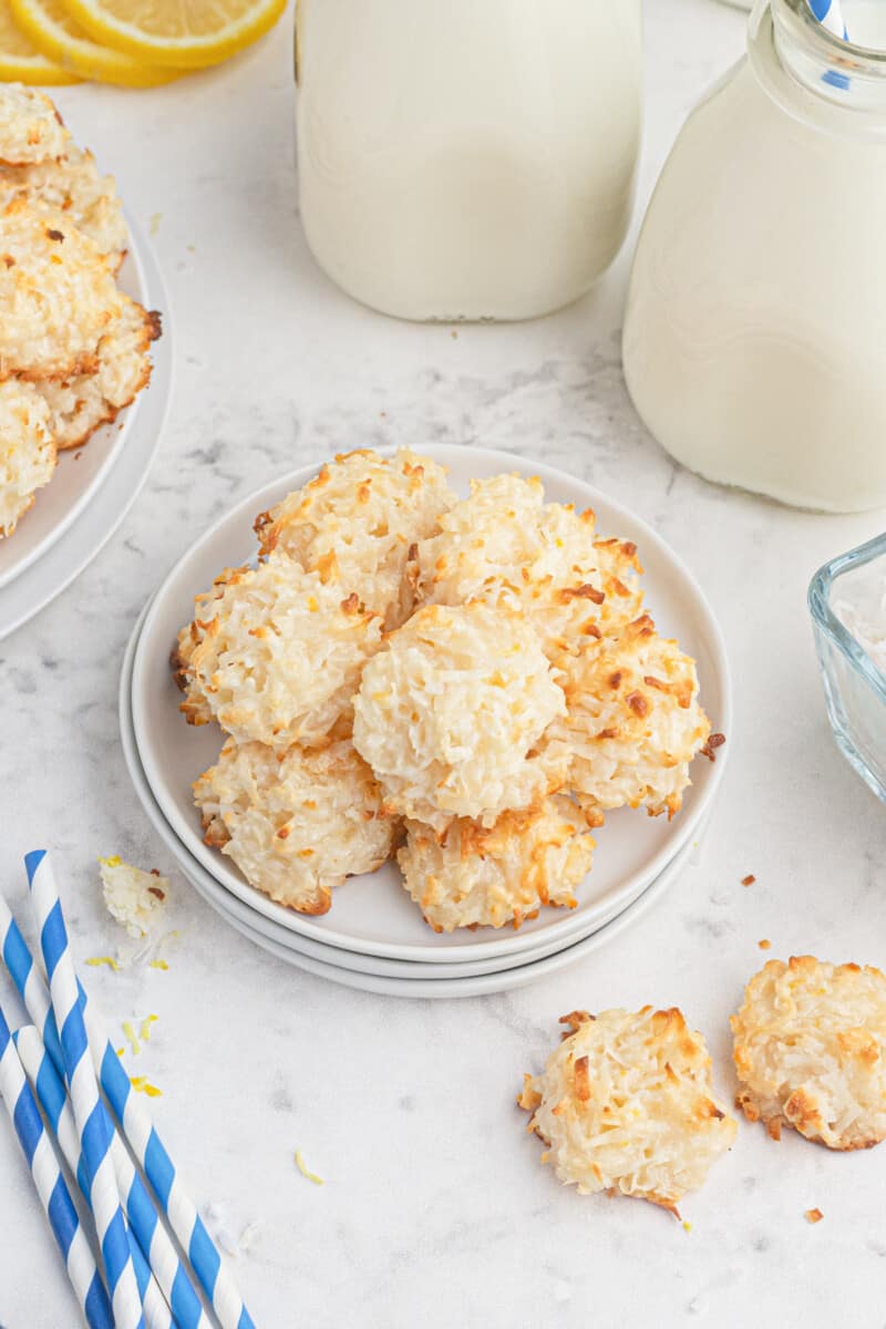 overhead view of coconut macaroons in a serving dish with milk jugs.