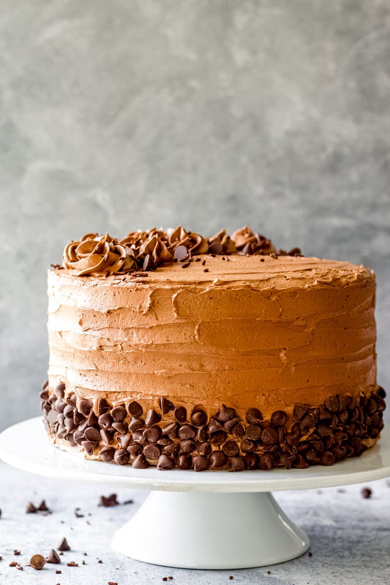 chocolate cake on a white cake stand