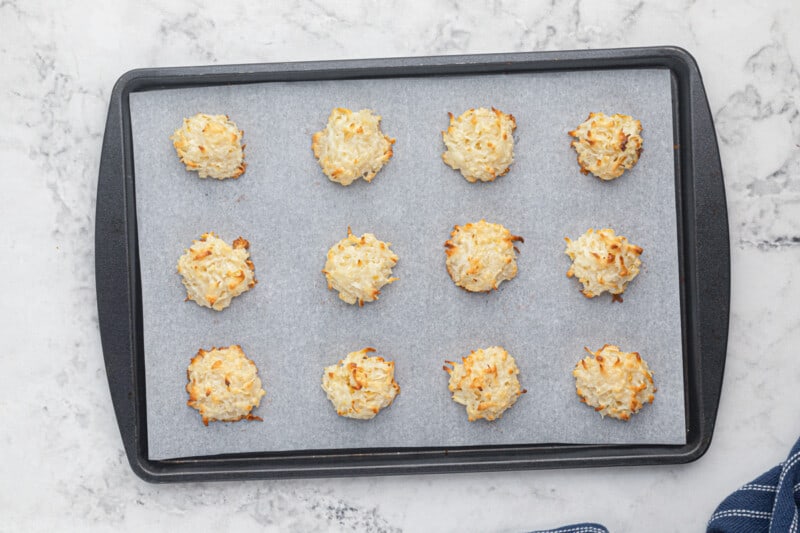 baked coconut macaroons on a baking sheet.