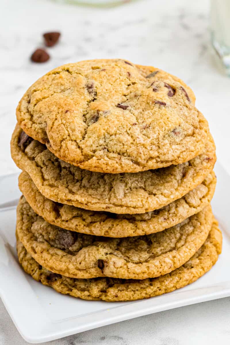 close up view of a stack of copycat mrs fields cookies.