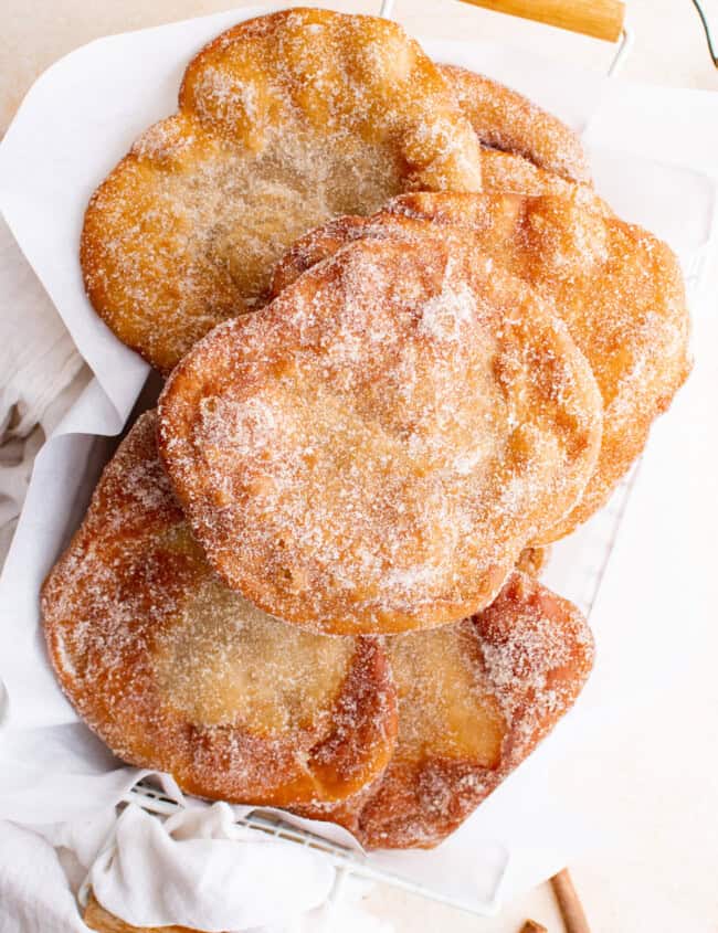 overhead view of elephant ears pastry stacked in a basket.