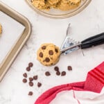 copycat mrs fields chocolate chip cookie dough in a portion scoop.