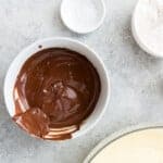 melty chocolate for fudgy brownies in a white bowl.