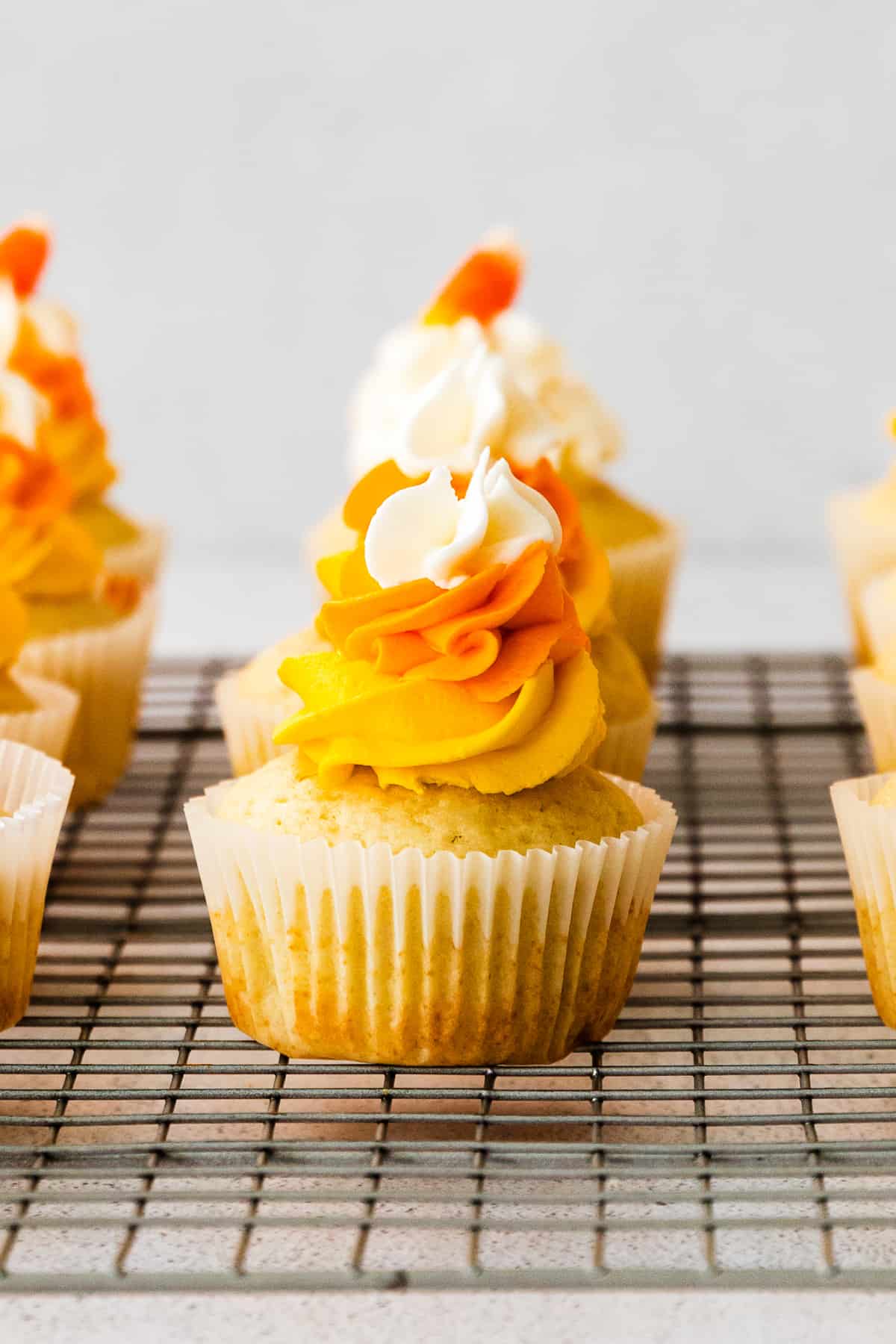 candy corn cupcakes on cooling rack