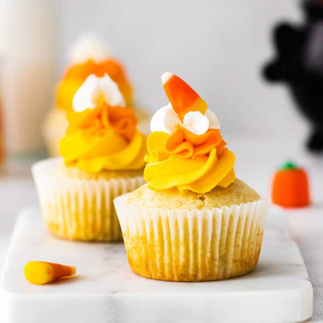 up close candy corn cupcakes on marble tray