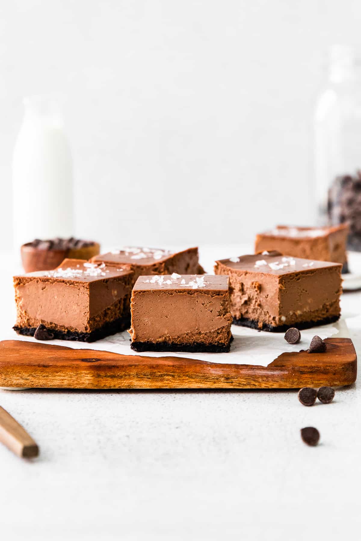 chocolate cheesecake bars on serving tray