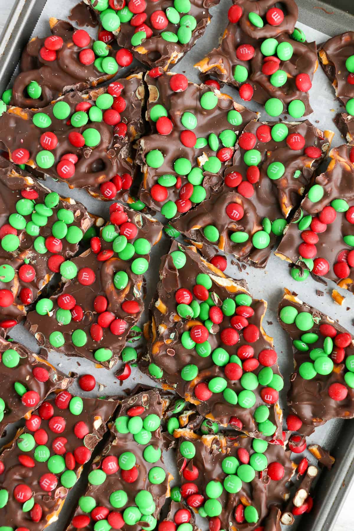 m&m chocolate pretzel bark on cookie sheet