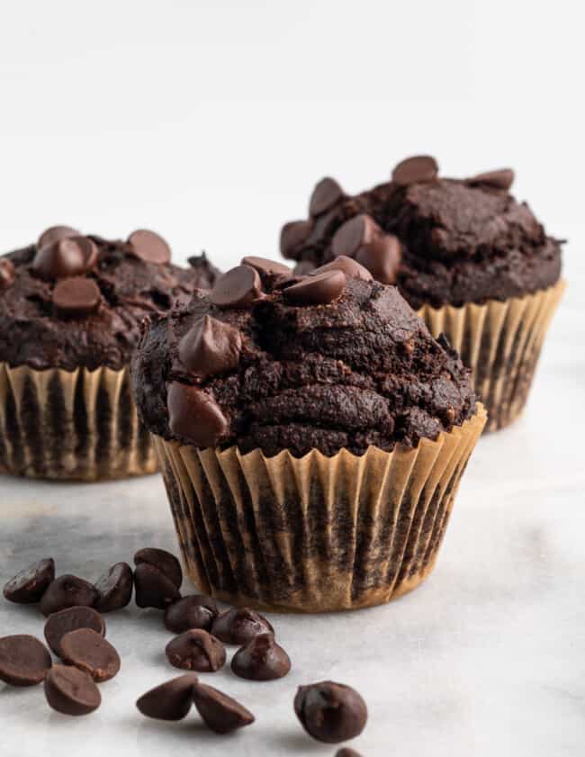 3 double chocolate blender muffins on marble