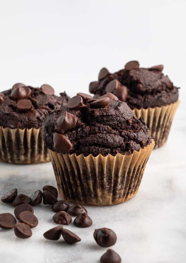 3 double chocolate blender muffins on marble