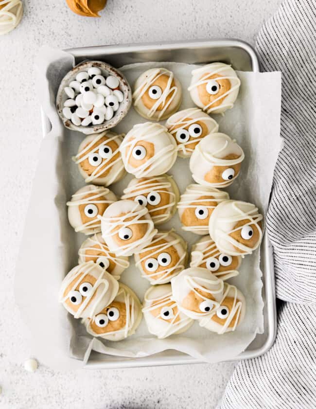 silver tray with white chocolate halloween buckeyes