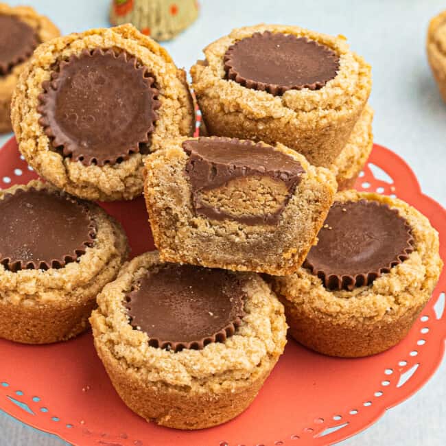 peanut butter cup cookies on orange cake stand
