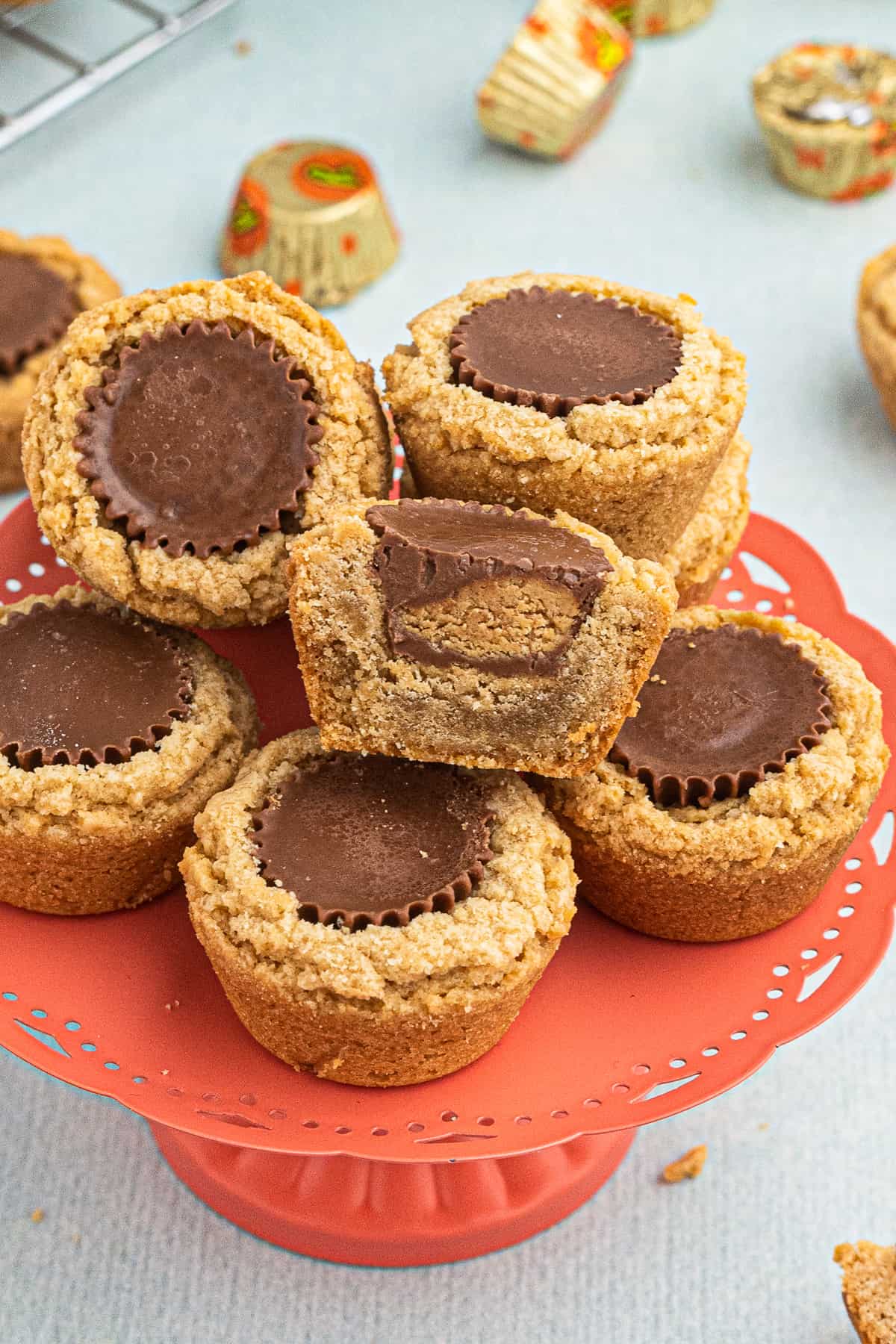 peanut butter cup cookies on orange cake stand