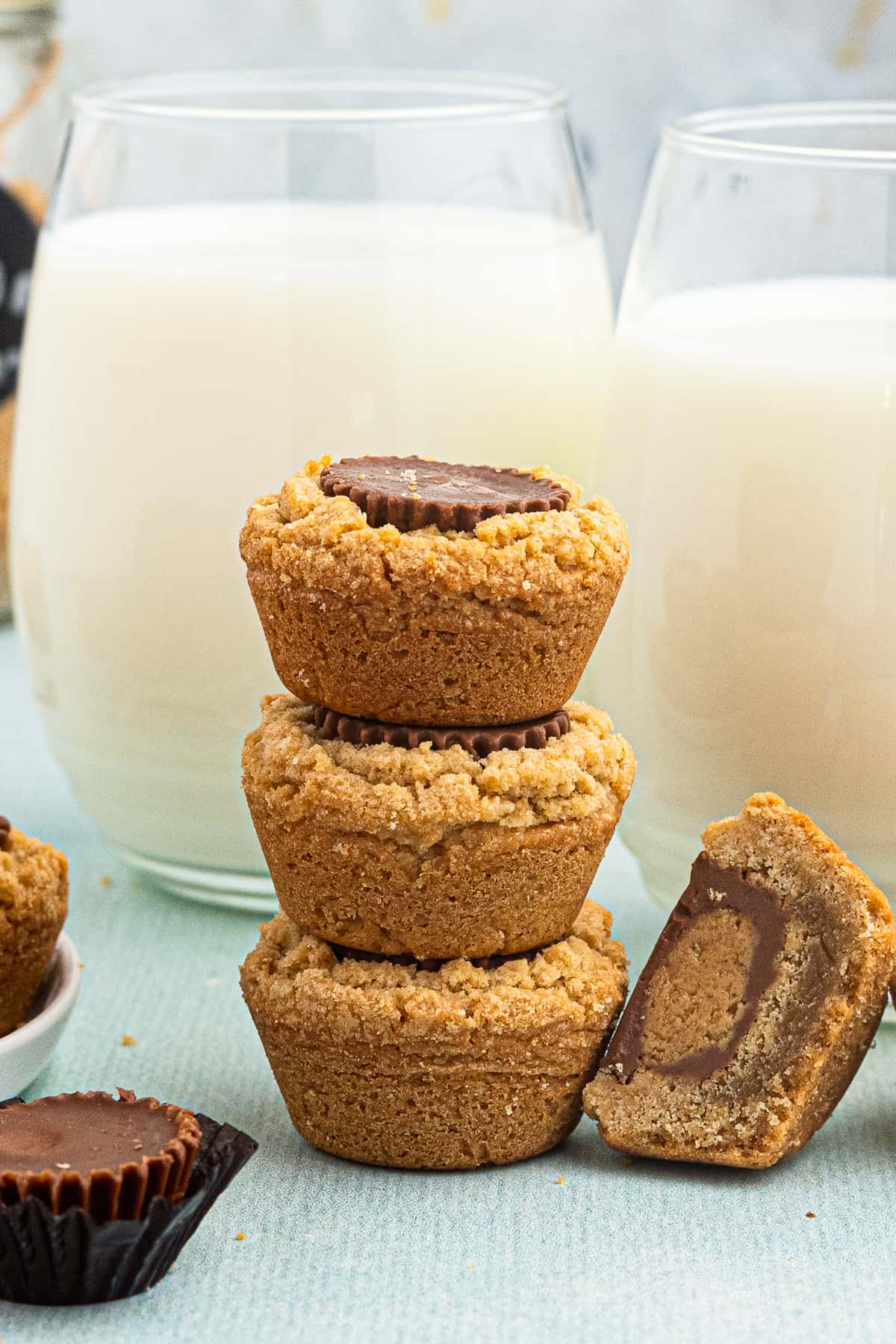 stacked peanut butter cup cookies with milk