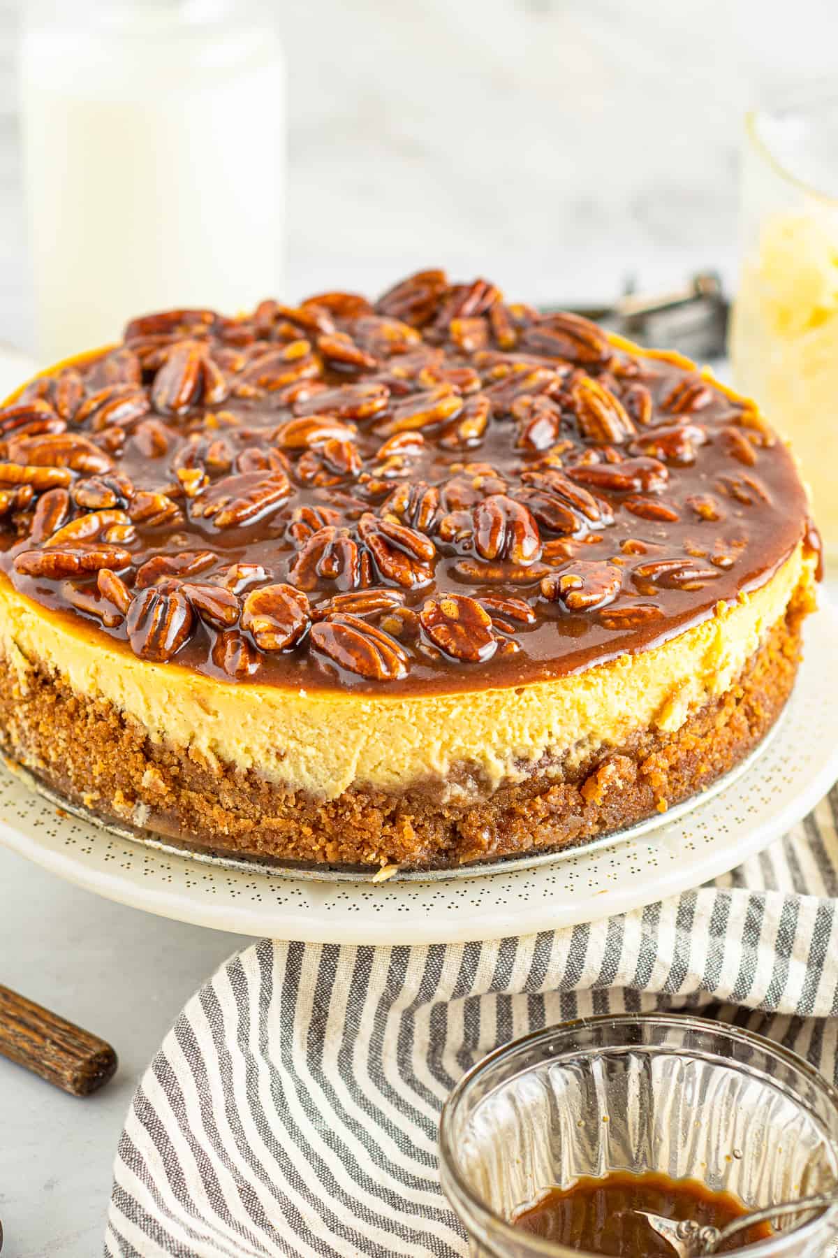 pecan pie cheesecake on cake stand