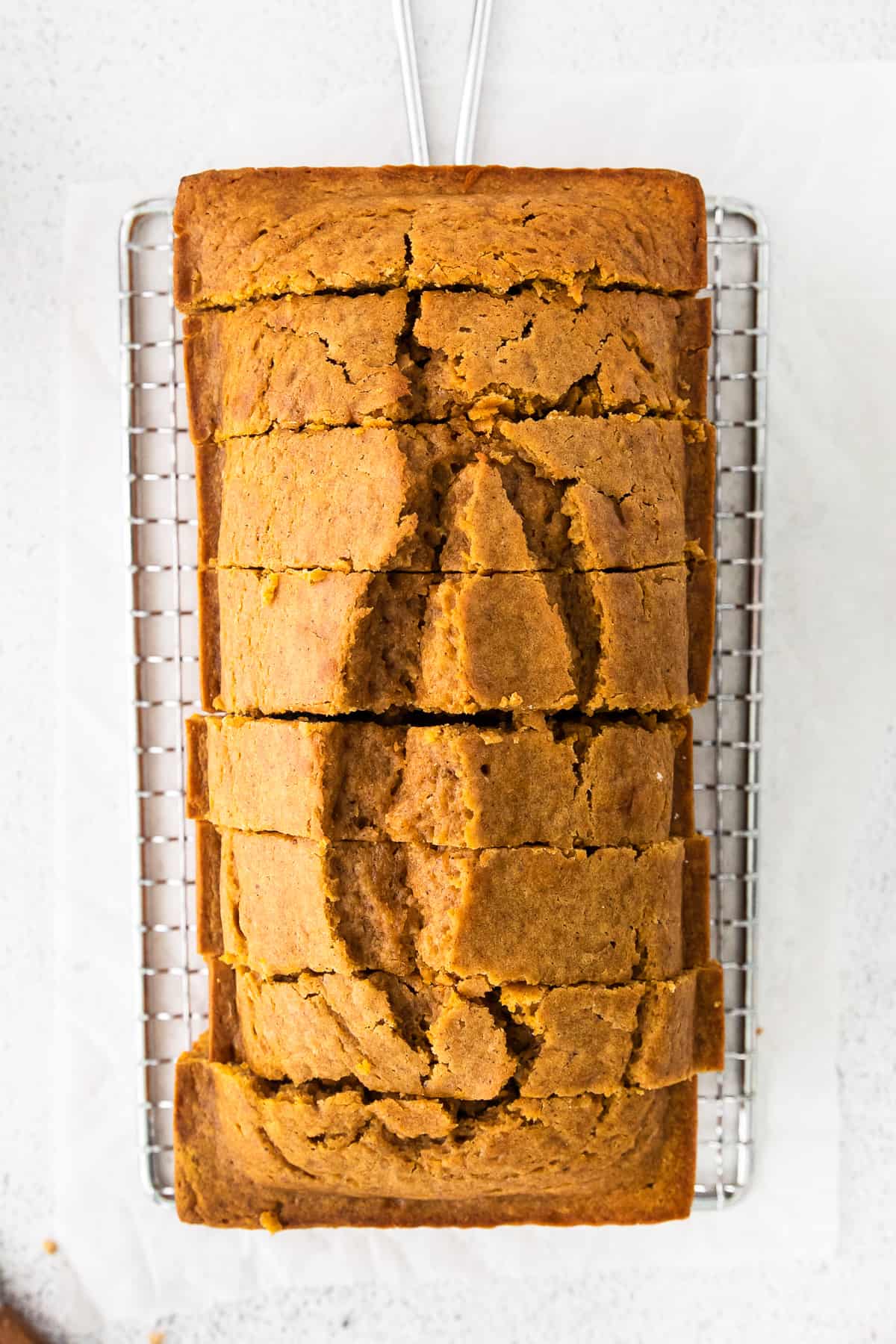 sliced pumpkin bread on cooling rack