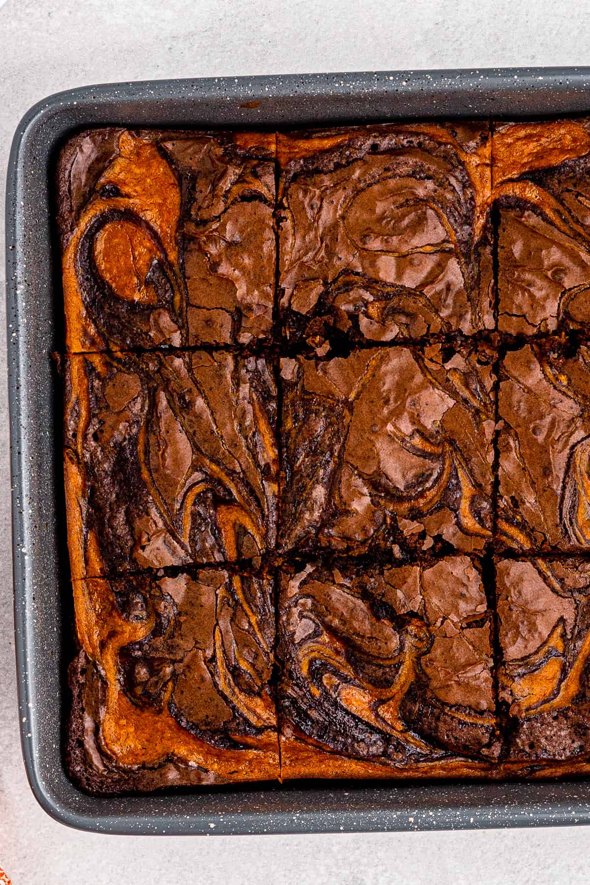 pan of swirled pumpkin pie brownies