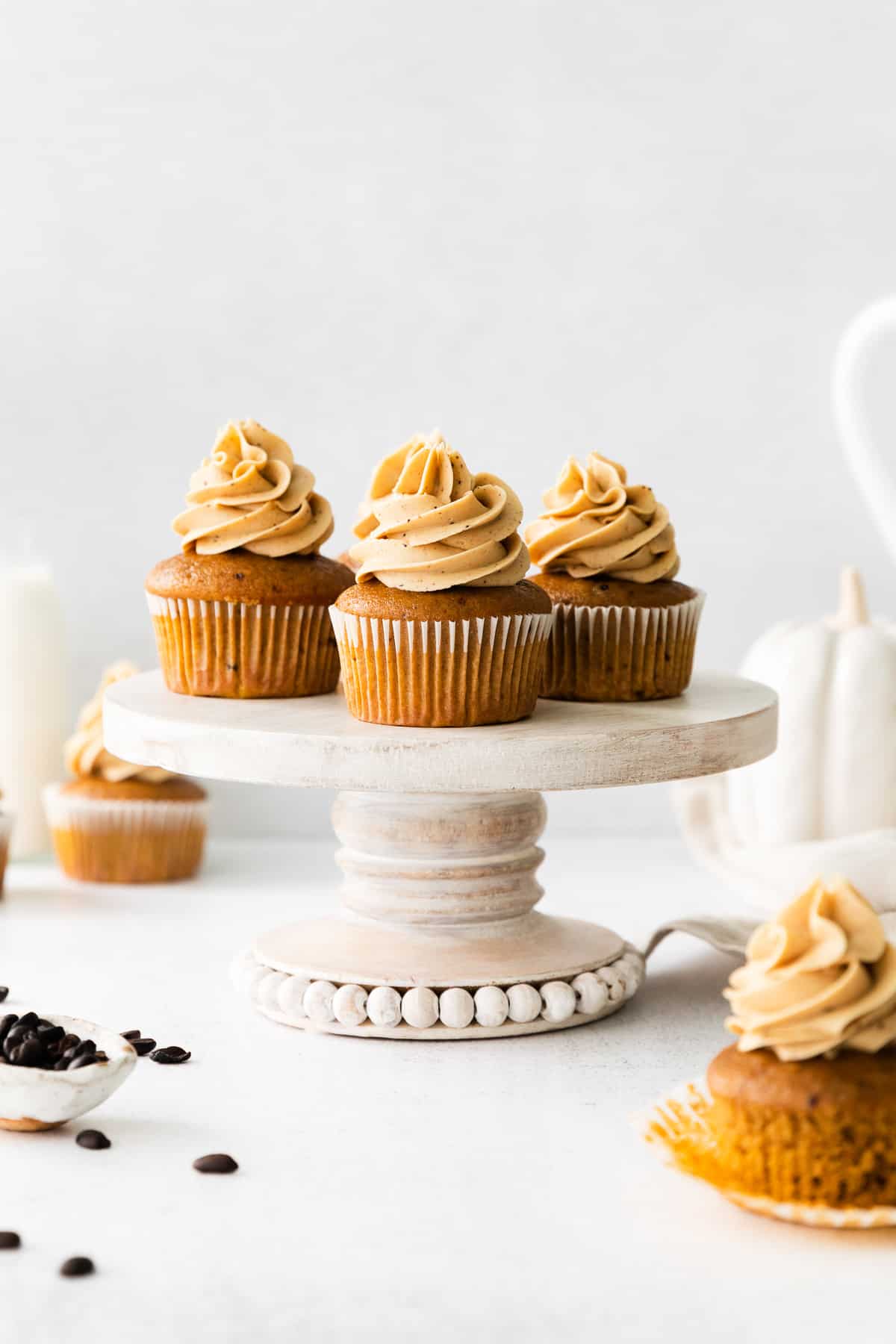 pumpkin spice latte cupcakes on cake stand
