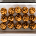 pumpkin chocolate chip oat bites on a baking sheet lined with parchment paper