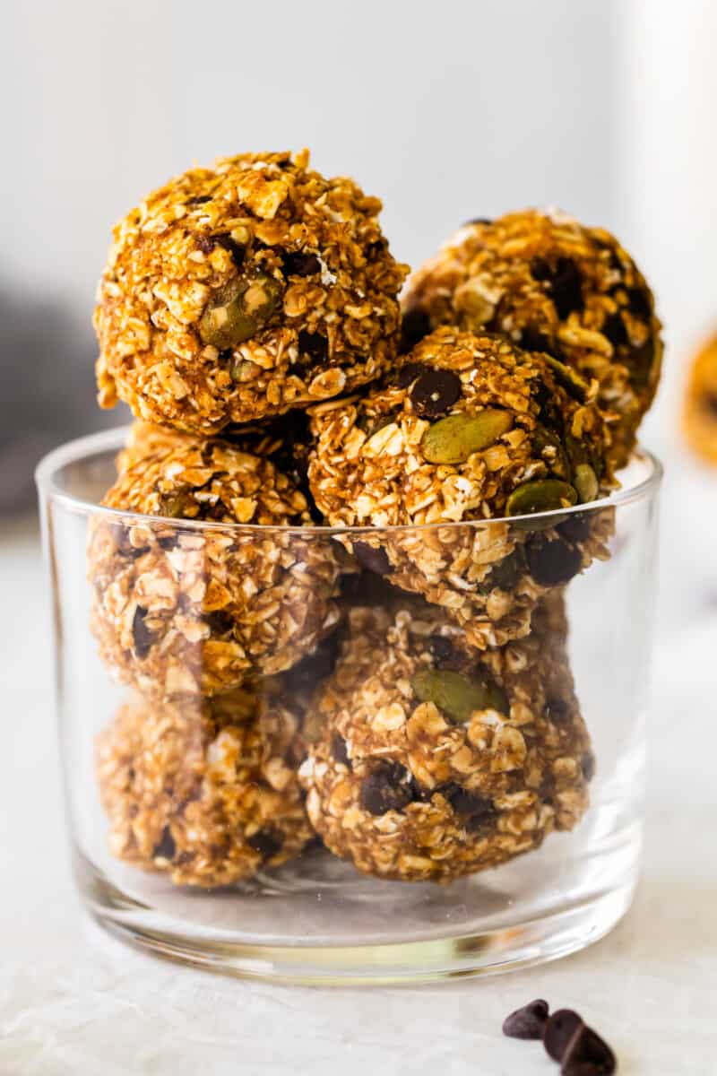 close up image of pumpkin chocolate chip oat bites in a glass bowl