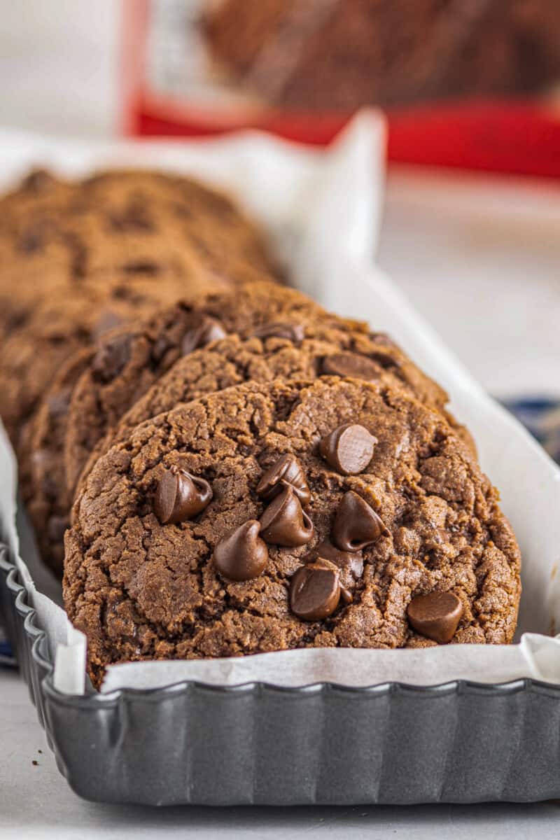 chocolate cookies with chocolate chips in a serving container