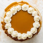 a pumpkin pie with whipped cream on top.
