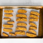 pumpkin pecan biscotti on a baking sheet after baking