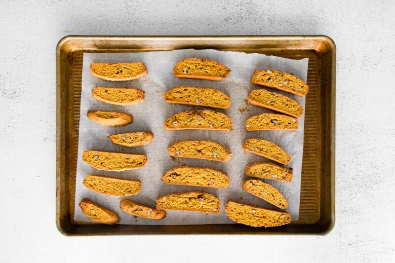 pumpkin pecan biscotti on a baking sheet after baking