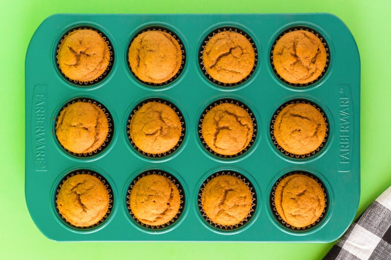 pumpkin cupcakes in a cupcake pan after baking