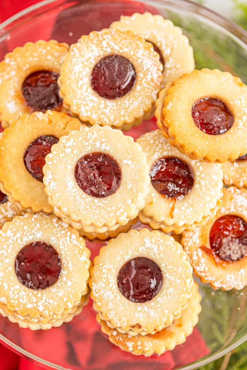overhead image of linzer cookies on a glass cake stand