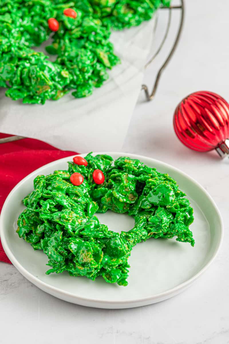 cornflake wreath on a white plate with a bite taken from it