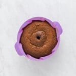 baked gingerbread bundt cake in a purple silicone bundt mould.