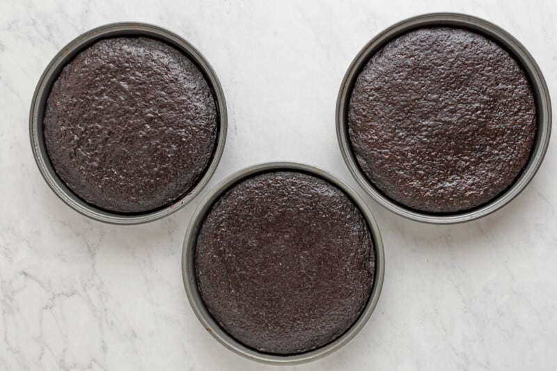 3 chocolate cake layers in round cake pans