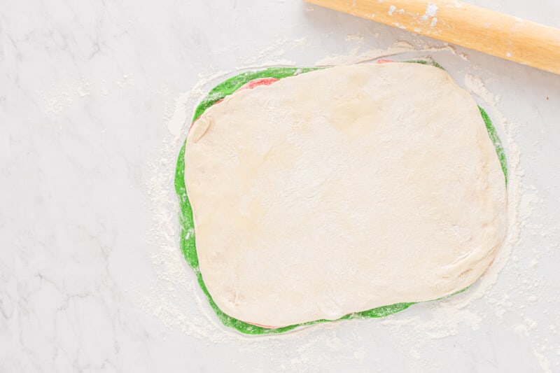 layered red, white, and green sandwich dough