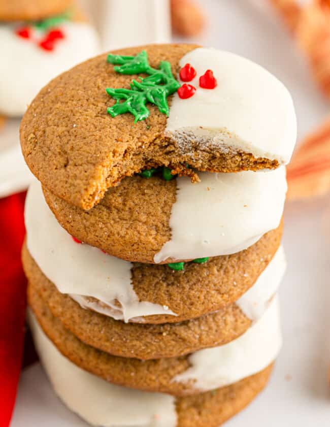 a bitten ginger sugar cookie stacked on 4 ginger sugar cookies.