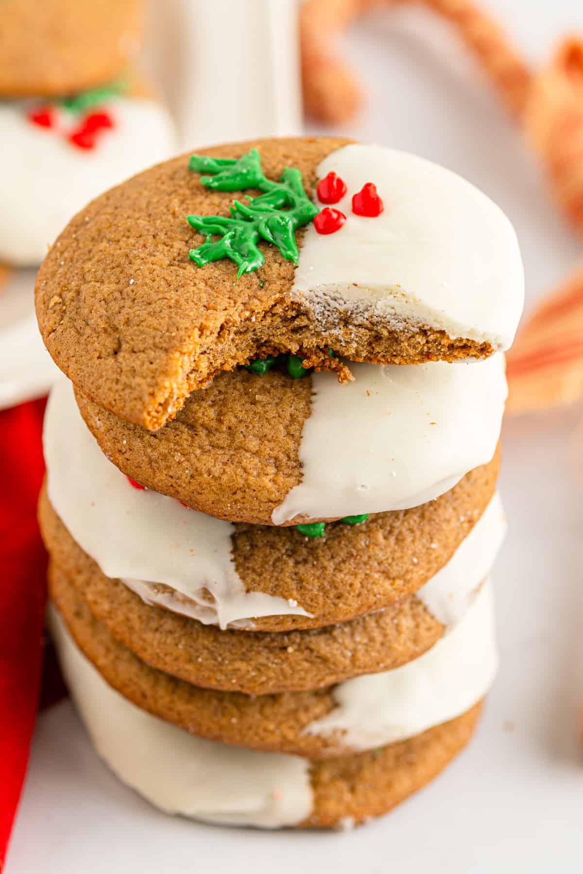 a bitten ginger sugar cookie stacked on 4 ginger sugar cookies.