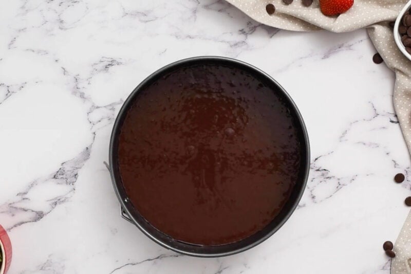 chocolate cake batter in a springform pan.