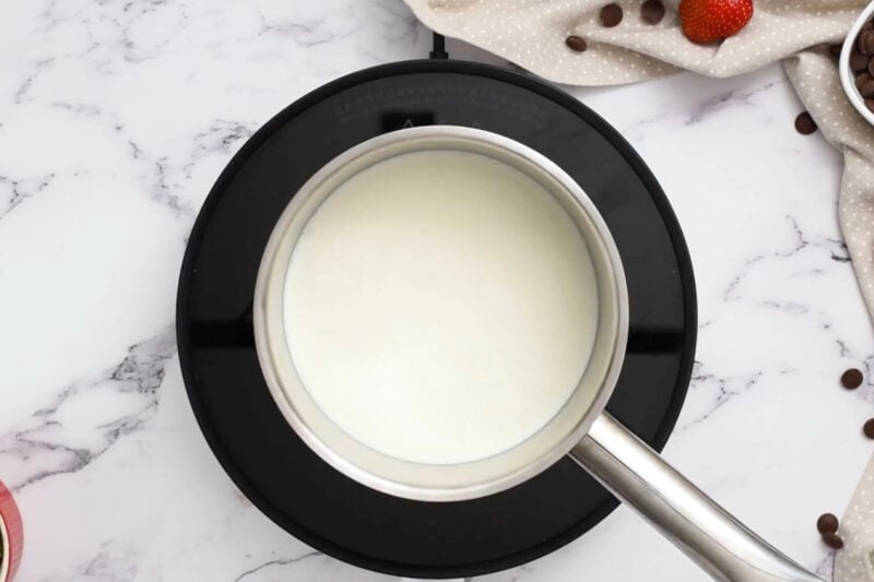 heating cream in a saucepan.