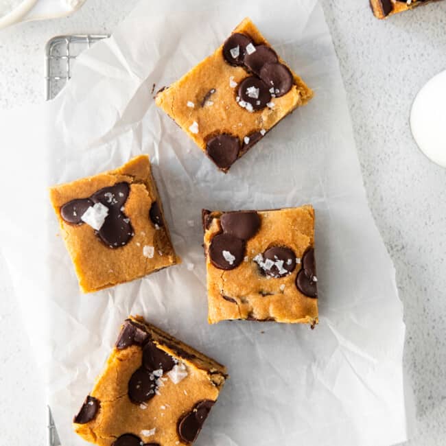 overhead image of chocolate chip cookie bars on parchment paper