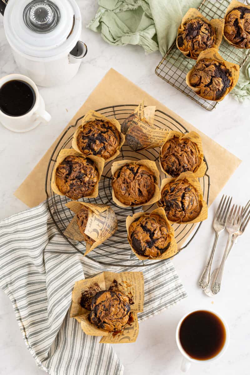 overhead image of chocolate peanut butter muffins on a cooling rack
