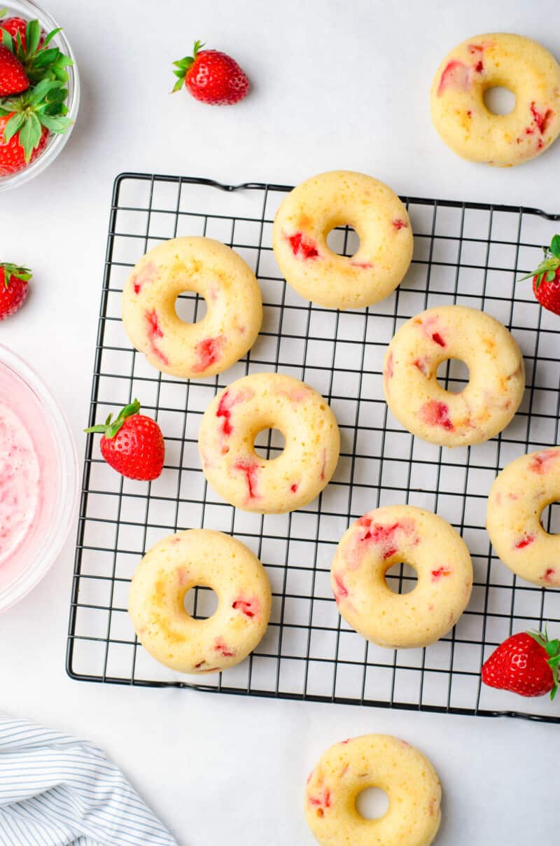 strawberry donuts without glaze on a cooling rack
