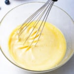 wet ingredients in a glass bowl with a whisk