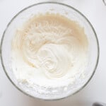 plain buttercream frosting in a glass bowl