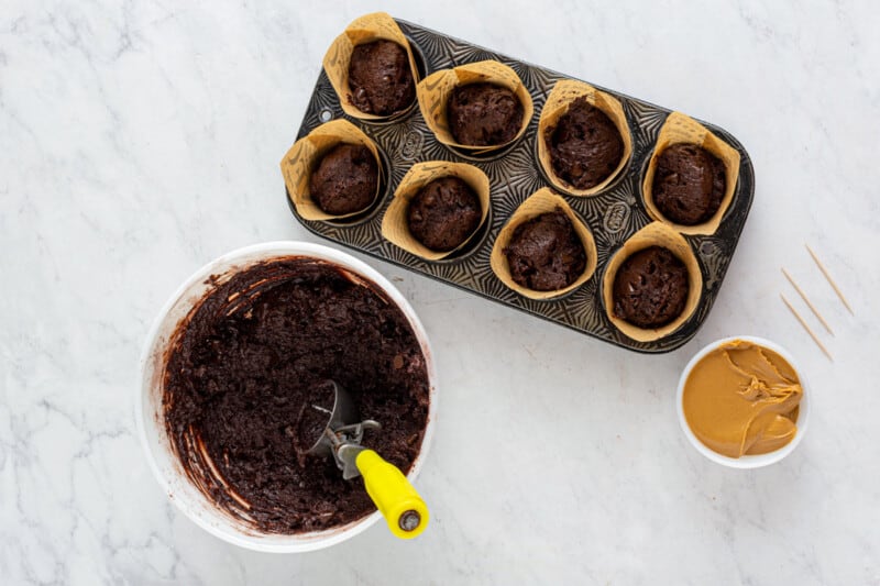 chocolate muffin batter in a muffin tin